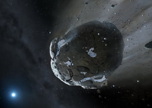 Künstlerische Darstellung eines wasserreichen Asteroiden, der durch die Gravitation des Weißen Zwerges auseinander gerissen wird. Ähnliche Objekte könnten auch in unserem Sonnensystem für den Großteil des Wassers auf der Erde verantwortlich sein.
