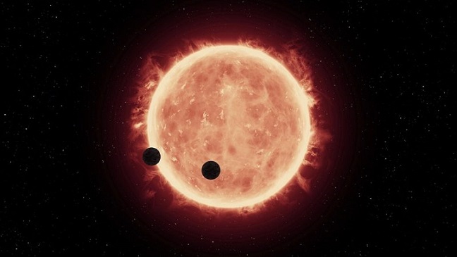 Künstlerische Darstellung von zwei erdgroßen Planeten, die einen Roten Zwergstern umkreisen. 